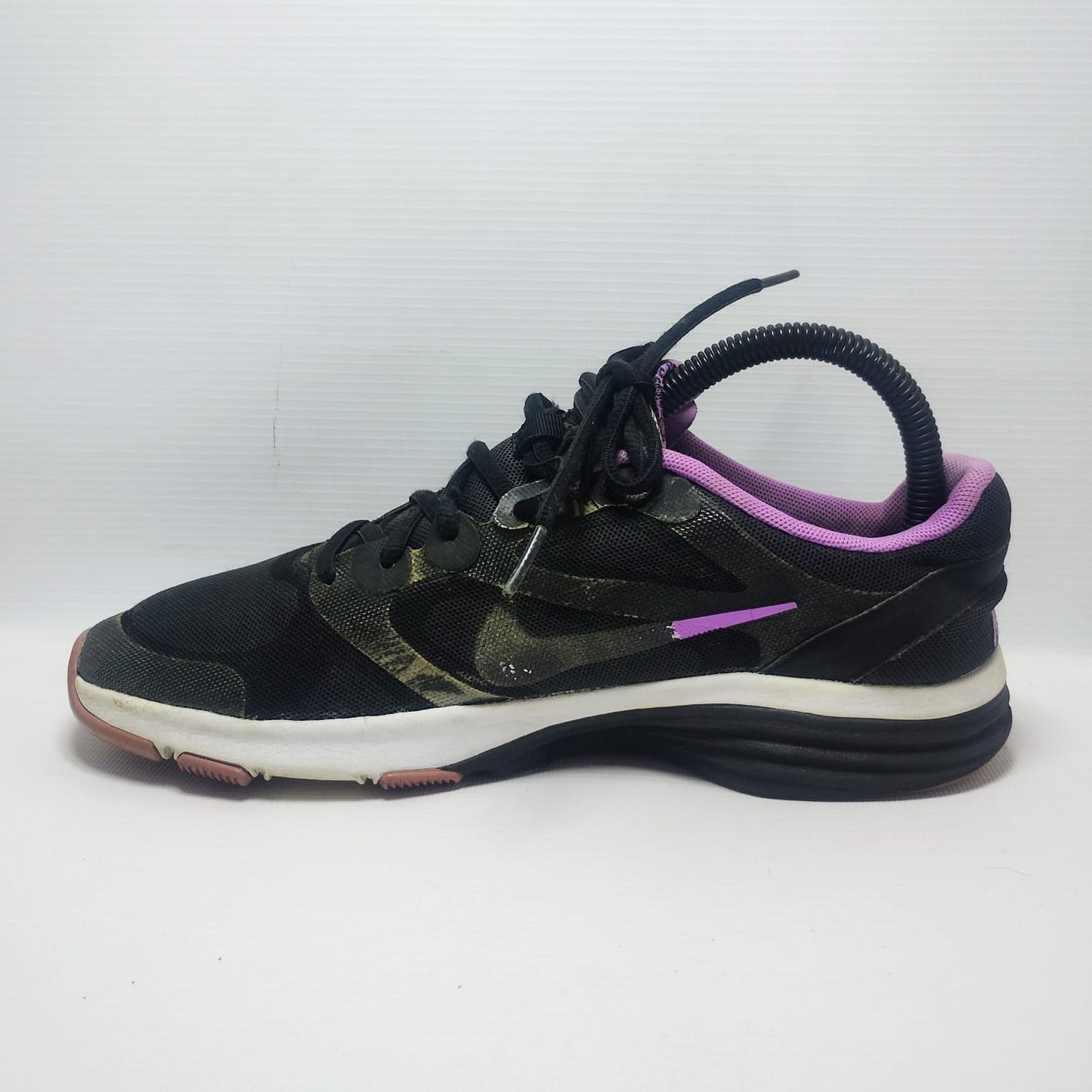 Nike Dual Fusion TR training shoe in a black and purple colorway.