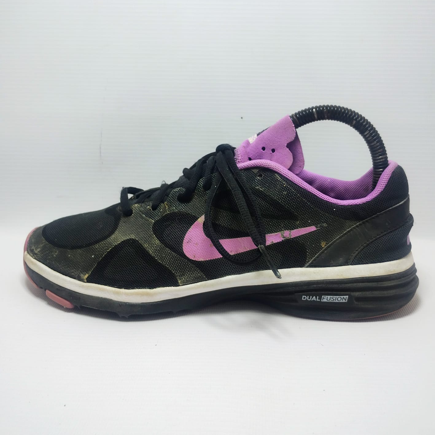 Nike Dual Fusion TR training shoe in a black and purple colorway.