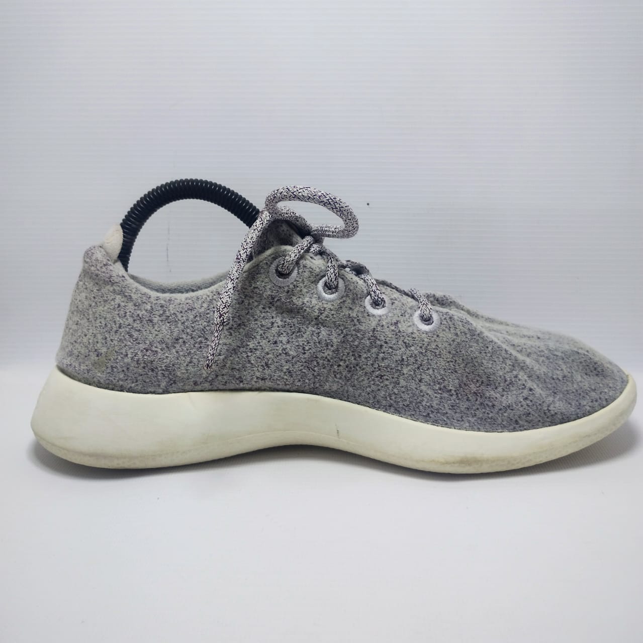 Allbirds Men's Wool Runner in a grey color with a white sole.