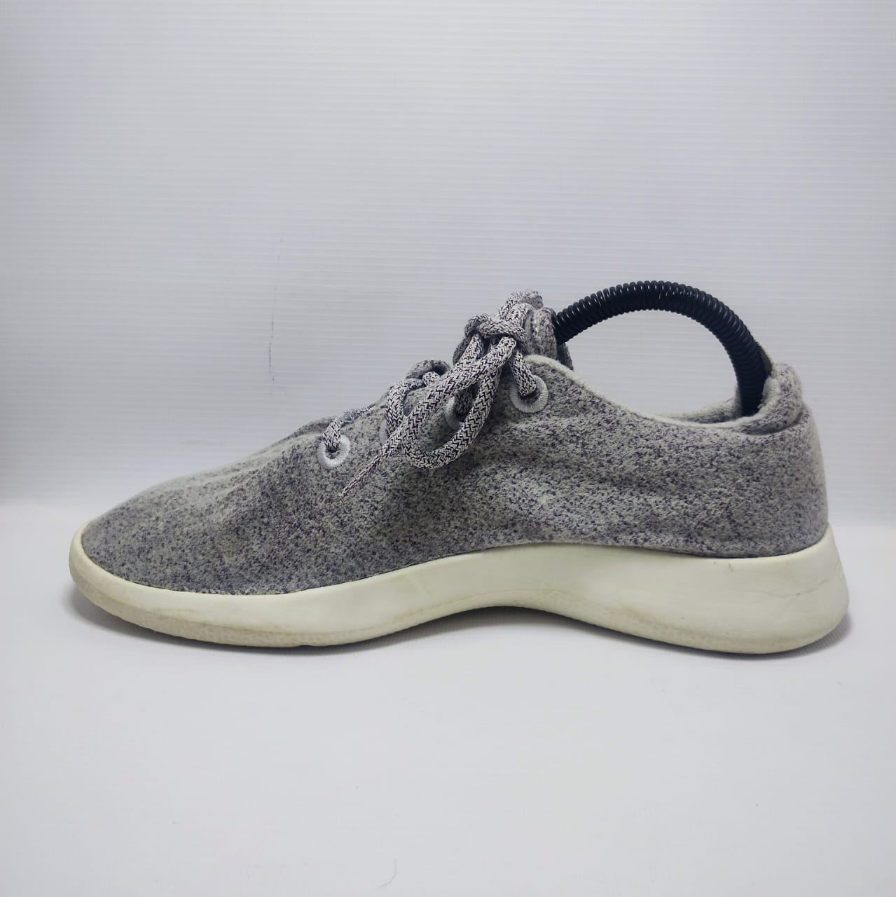 Allbirds Men's Wool Runner in a grey color with a white sole.