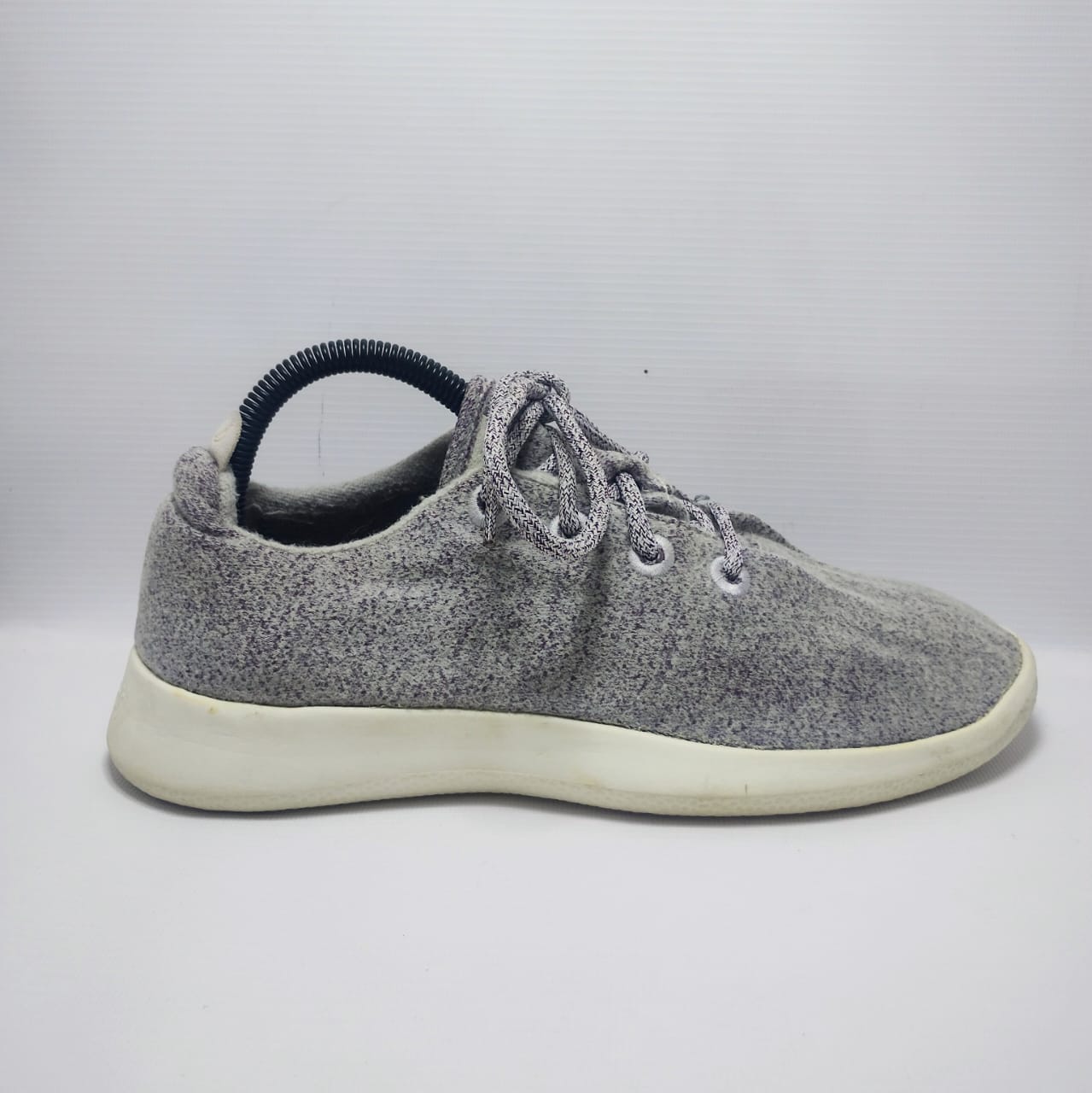 Allbirds Men's Wool Runner in a grey color with a white sole.