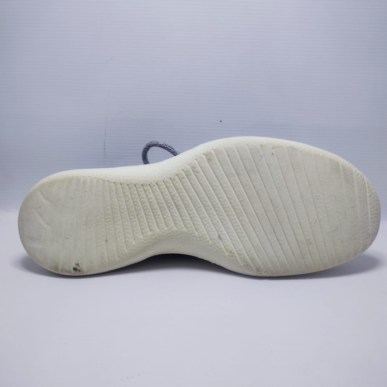 Allbirds Men's Wool Runner in a grey color with a white sole.