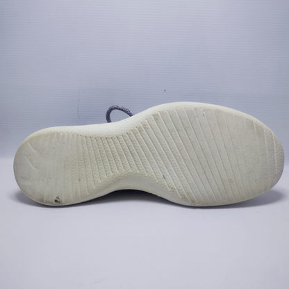 Allbirds Men's Wool Runner in a grey color with a white sole.