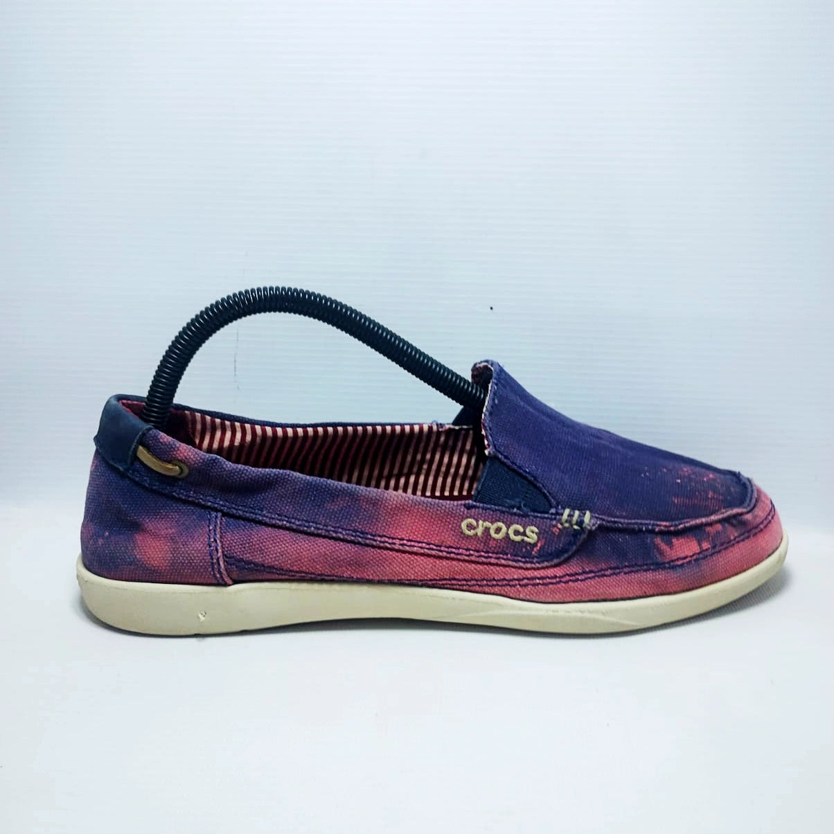 Crocs Walu canvas loafers in a purple and pink distressed colorway