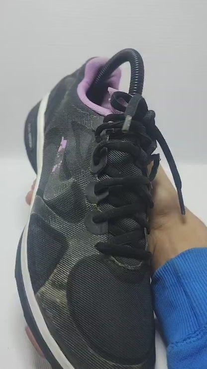 Nike Dual Fusion TR training shoe in a black and purple colorway.