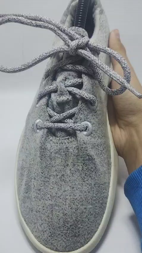 Allbirds Men's Wool Runner in a grey color with a white sole.