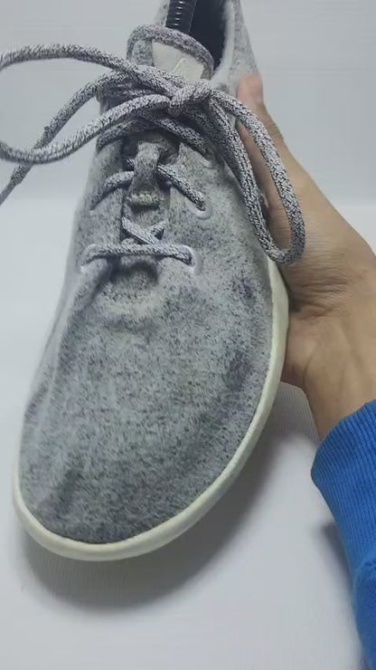 Allbirds Men's Wool Runner in a grey color with a white sole.